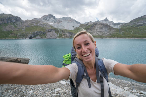 istock Hiking young woman taking selfie portrait 843571920