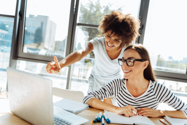 istock Cheerful female friends studying together 843573096