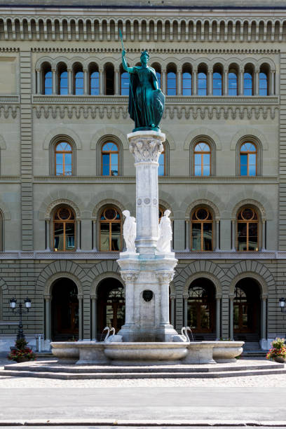 Berna fountain with monument infront of Bundeshaus West in Bern Berna fountain with monument infront of Bundeshaus West in Bern bundeshaus stock pictures, royalty-free photos & images