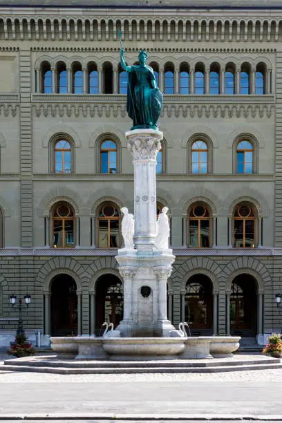 Berna fountain with monument infront of Bundeshaus West in Bern