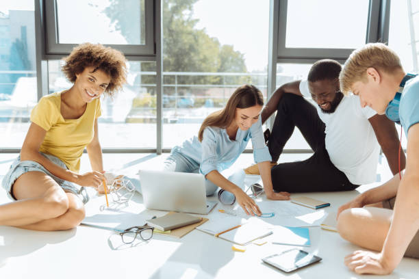 istock Cheerful international students working on the university project 843577488