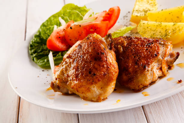 istock Roast chicken leg and vegetables 843578228