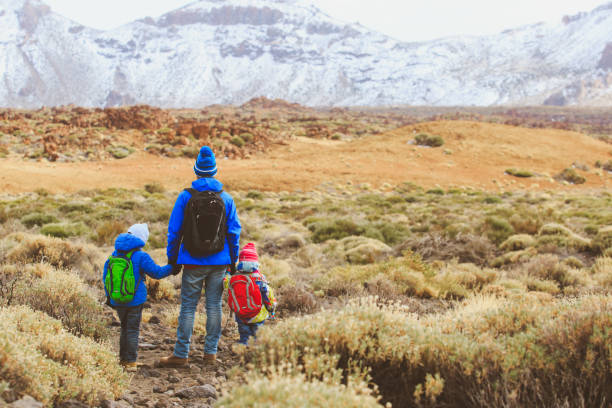 istock father with two kids travel in mountains 843581184