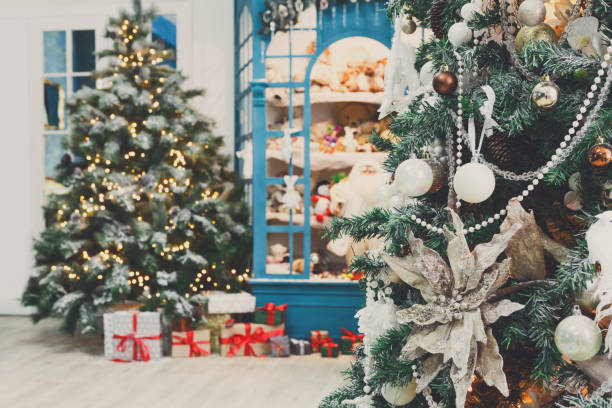 istock Christmas is coming. Decorated fir trees and presents background 843581624