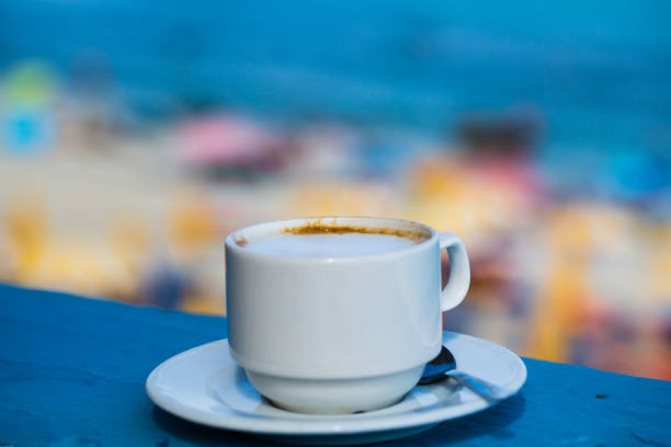 istock Cup of cappuccino with sea view 843583364