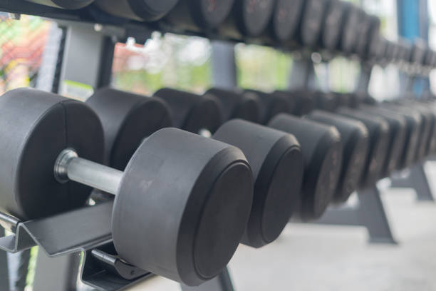 istock Fitness background with dumbbells in gym 843586784