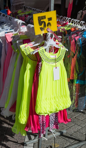 istock Market stall with neon colored trashy clothing 843586880