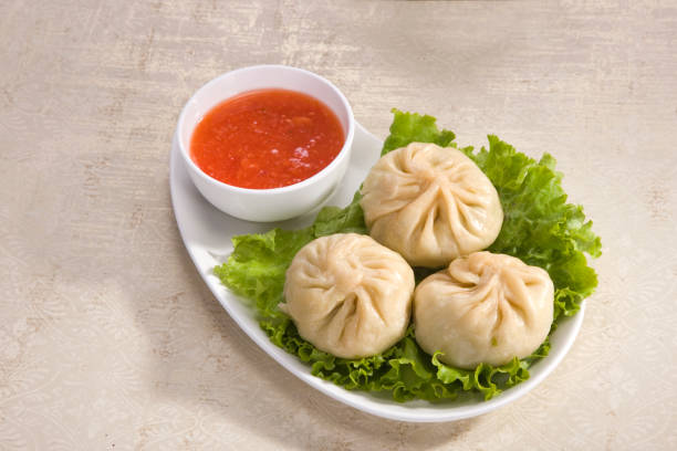 Traditional Dumpling Momos Served With Tomato Sauce