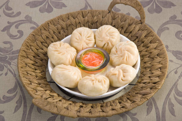 istock Traditional Dumpling Momos Served With Tomato Sauce 843587220