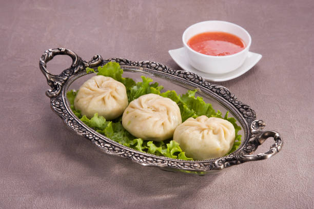 istock Traditional Dumpling Momos Served With Tomato Sauce 843587232