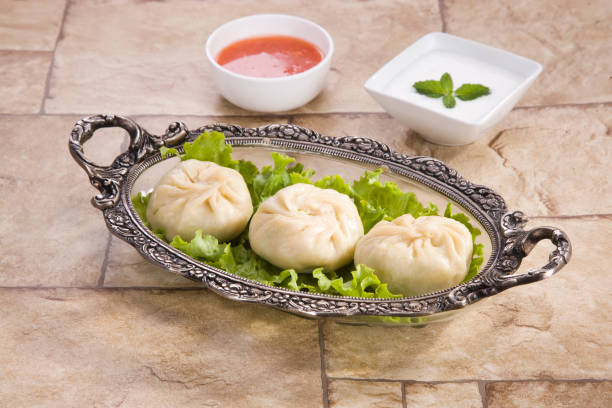 istock Traditional Dumpling Momos Served With Tomato Sauce 843587268