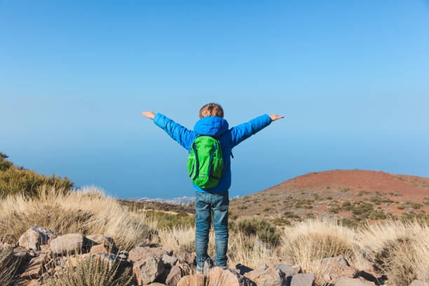 istock happy little boy hiking in mountains 843587390