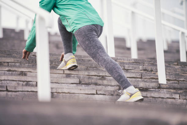 istock Woman stretching leg on stadium stairs. 843589522