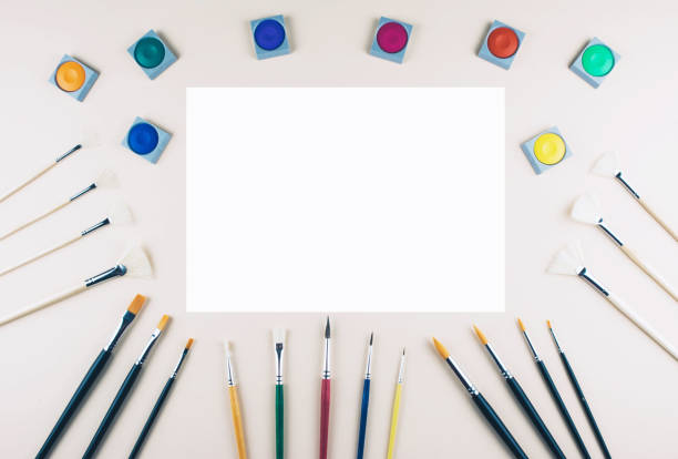 istock Watercolor and brushes at beige background. 843589890
