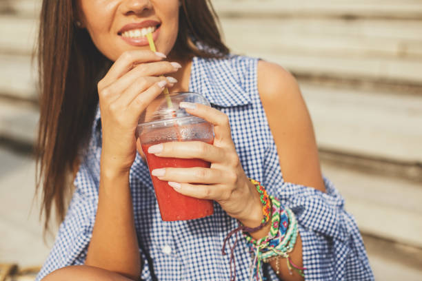 istock Girl drinks a healthy refreshing smoothy 843591414