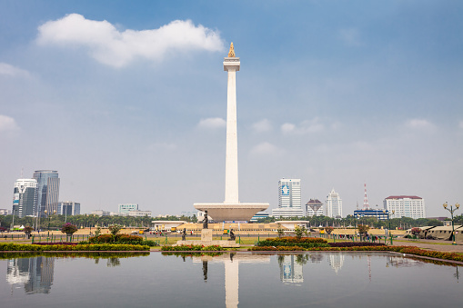 JAKARTA, INDONESIA - OCTOBER 21, 2014: The National Monument is a 132m tower in the centre of Merdeka Square, Jakarta, symbolizing the fight 