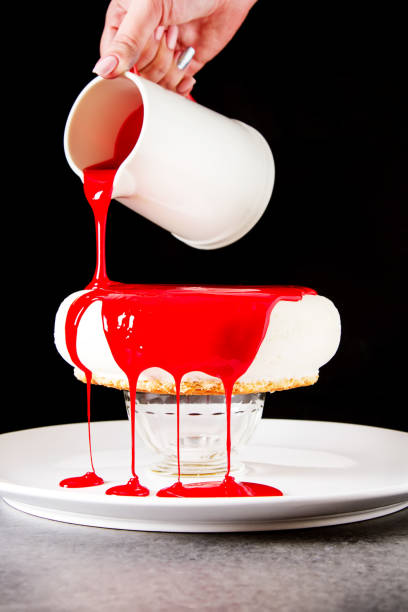 istock The process of preparing a mousse cake. Dark background. 843594978