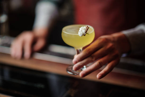 istock bartender hands with cocktail on the bar stand 843595444