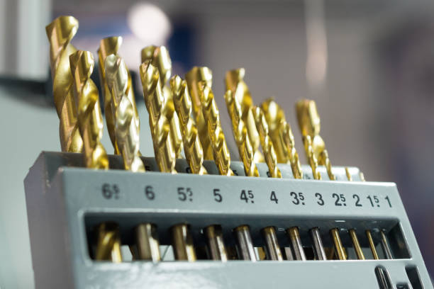 Placer carbide drills for metal Placer carbide drills for metal. Drill lying on a blue cloth. boreray and stac lee stock pictures, royalty-free photos & images
