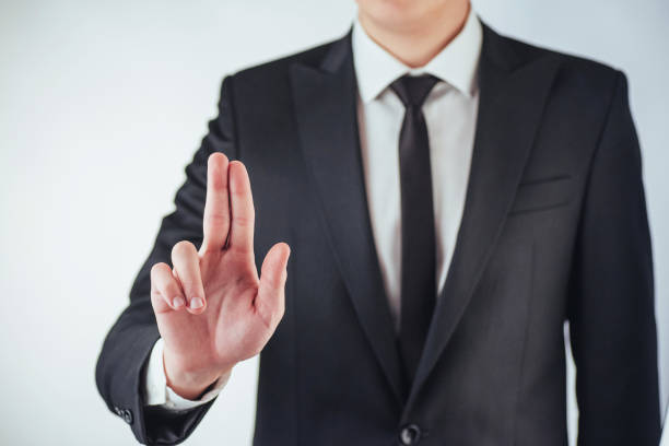 istock Businessman hand pointing on empty space on black background 843607592