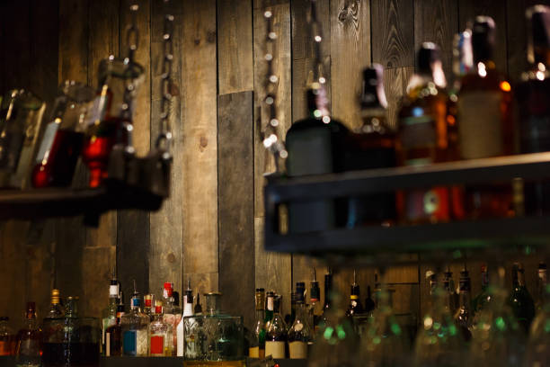 istock Bar background, wooden wall and drinks 843611256