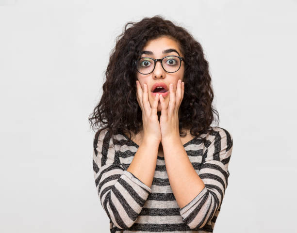 istock young woman facial expressions 843616922