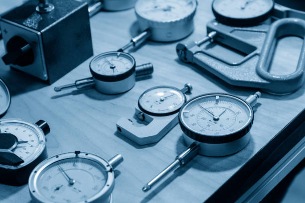 The industry measurement instrument in the light blue scene.The various type of dial gauge for industrial instrument