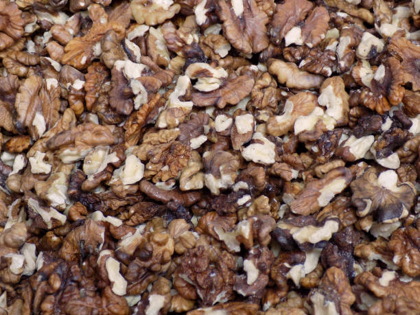 istock bunch of walnuts, edible as a background 843620388