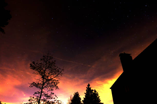 istock Stars under a blanket of orange clouds 843622920
