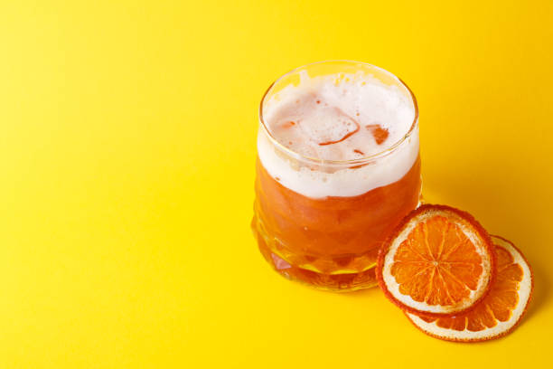 istock Orange cocktail with citron on colorful background 843630112