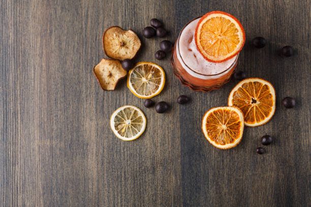 istock Orange cocktail with citron on wooden background 843630188