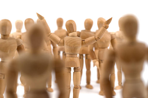 istock Wooden mannequin is happy in the crowd 843630442