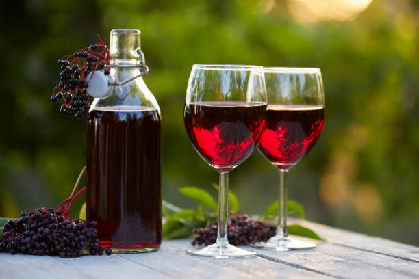istock Glasses of elderberry wine and elderberries 843630572