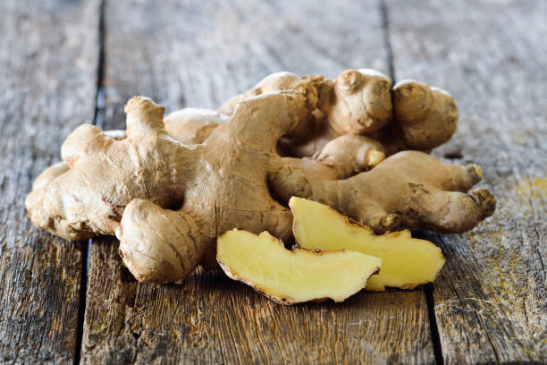 istock ginger sliced in wood bowl 843631390