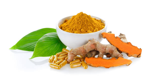 istock fresh turmeric and turmeric capsules on white background 843631480