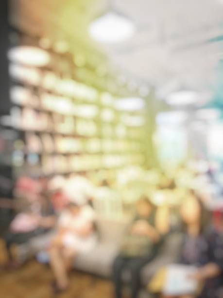 istock Blurred image of people sitting in cafe reading books and  using computers, smartphone.Education concept 843634130