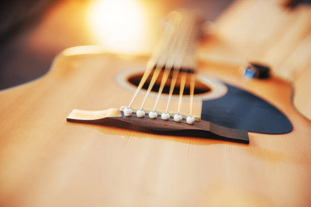 istock Photo fragment classical guitar on a light brown background. 843634144