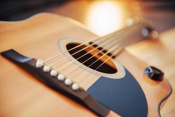 istock Photo fragment classical guitar on a light brown background. 843634192