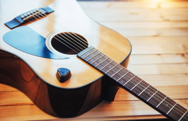 istock Photography classical guitar on a light brown background 843634550