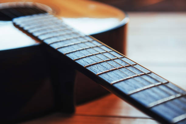 istock Photography classical guitar on a light brown background 843634836