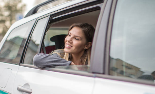 istock Blond woman driving in car 843635070