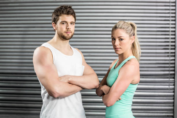 istock Fit couple posing with arms crossed 843641498