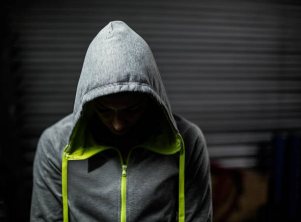 istock Athlete wearing hood with head down 843641708