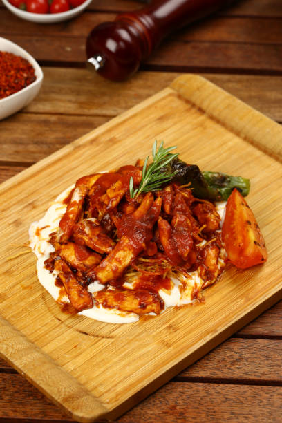 istock Chicken meat with tomato sauce and yogurt 843643556