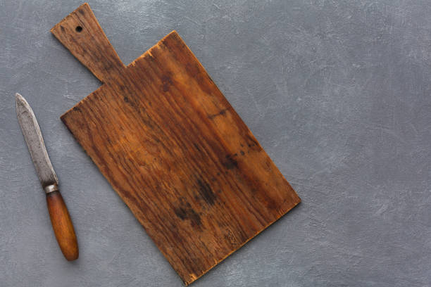 istock Wooden desk on gray background with copy space 843648830