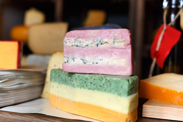 istock Striped colored cheese at grocery shop background, closeup 843652874
