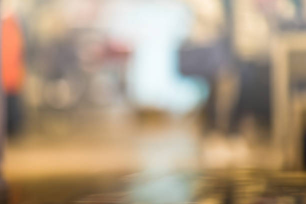 istock Blurred people at shopping mall background go shopping. Empty floor can be used as copy space for you text 843652896