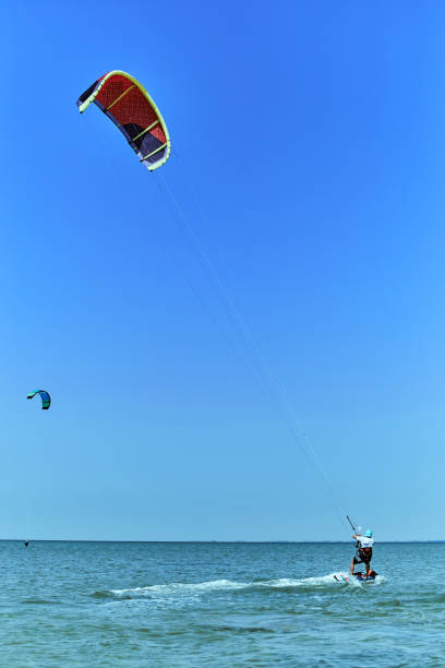 istock Kite Surfing on waves at sea in summer. 843653456