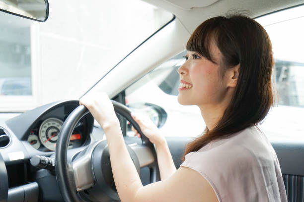istock Young woman driving a car 843656296