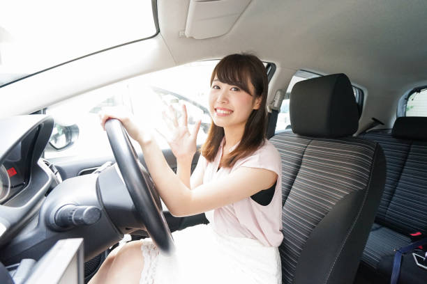 istock Young woman driving a car 843656366